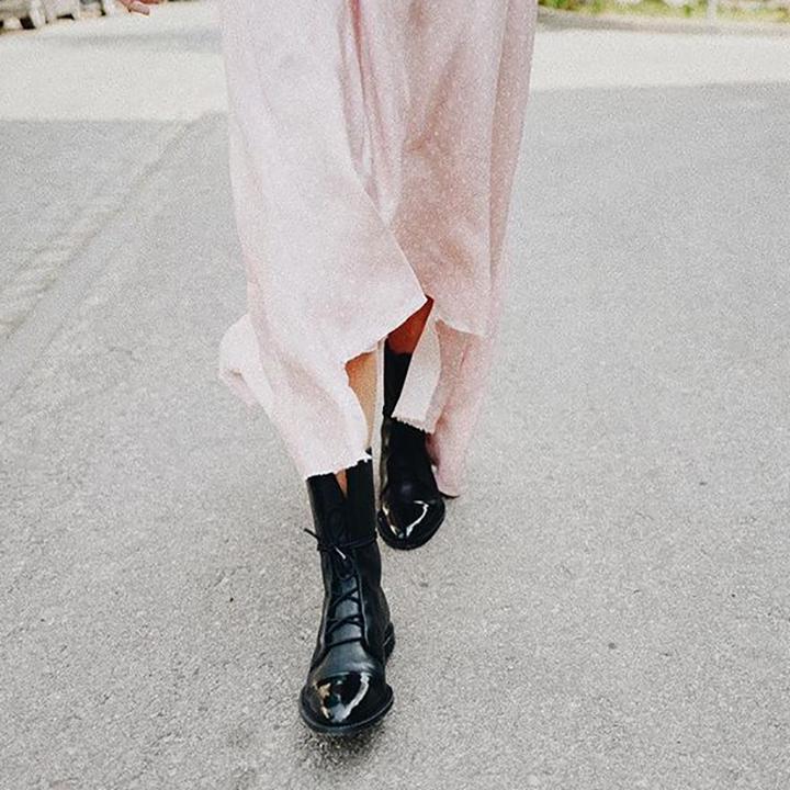 Women's mid-calf lace-up boots styled with casual autumn outfit
