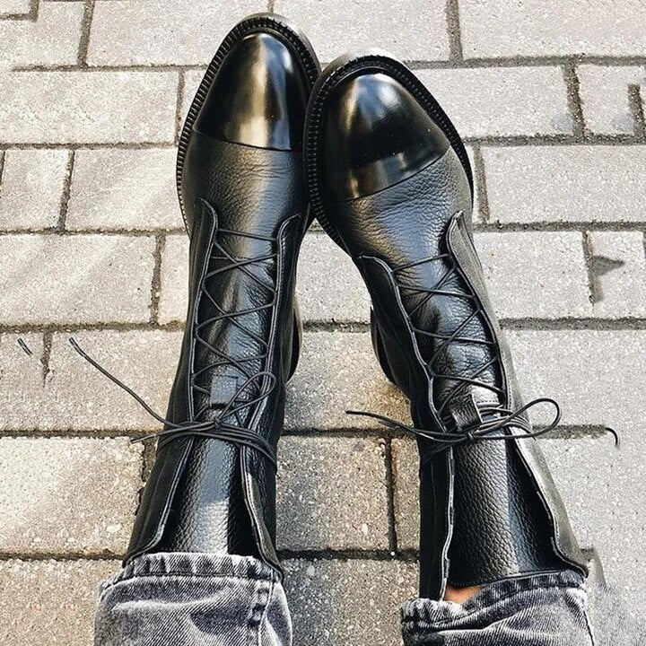 Textured finish on women's lace-up ankle boots with tread pattern sole