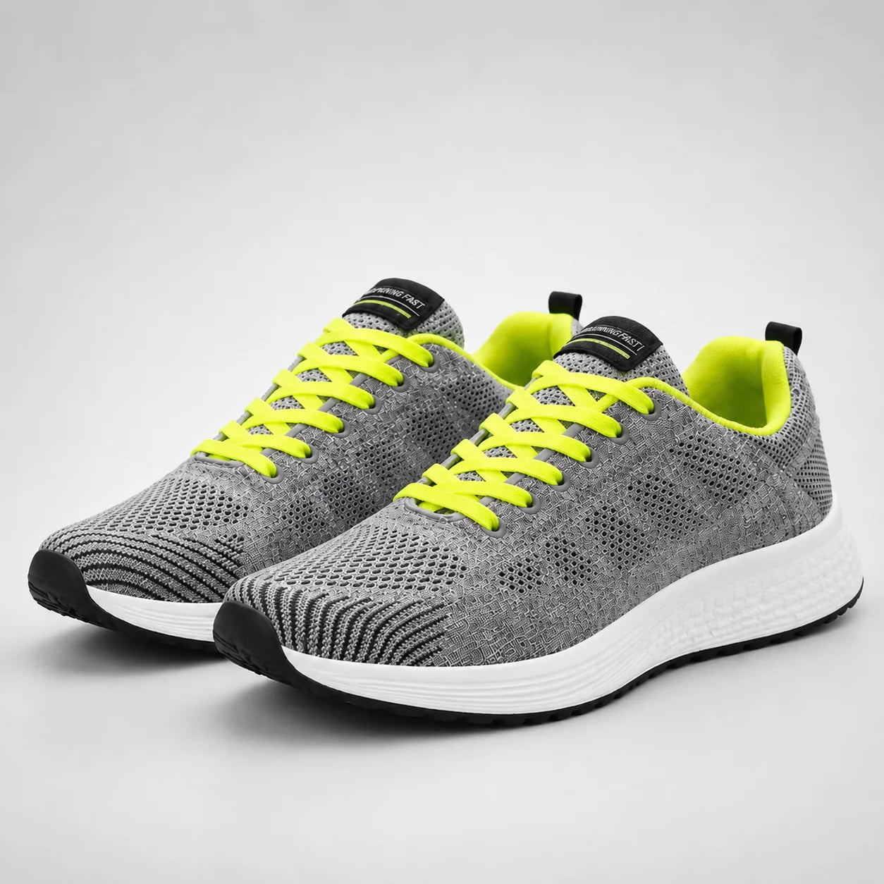 Side view of women's breathable mesh trainers showing knit upper and supportive midsole