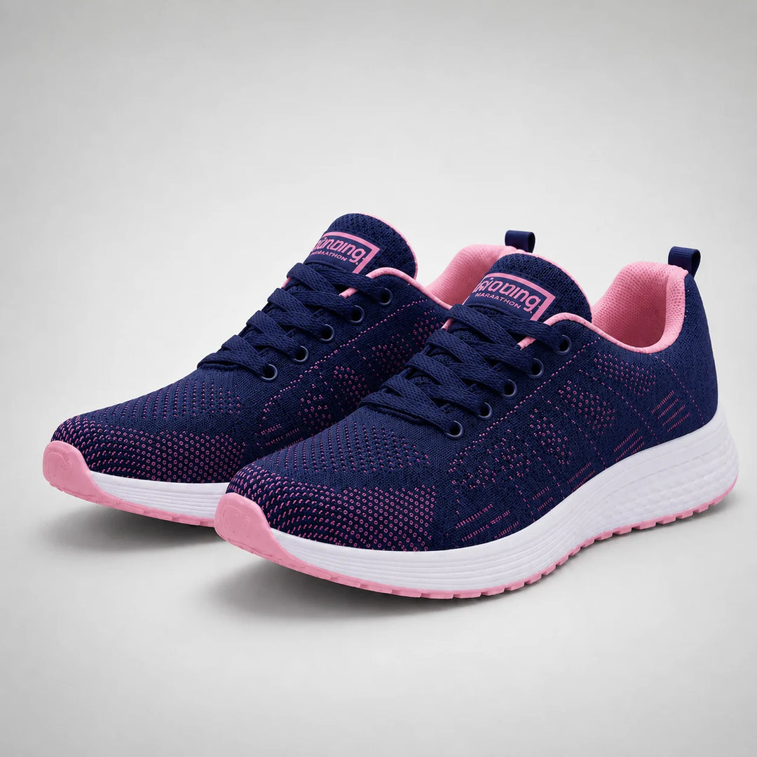 Close-up of women's mesh trainers highlighting open-weave construction and lace-up closure