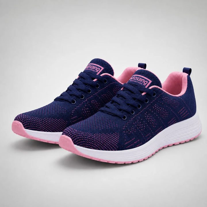 Close-up of women's mesh trainers highlighting open-weave construction and lace-up closure