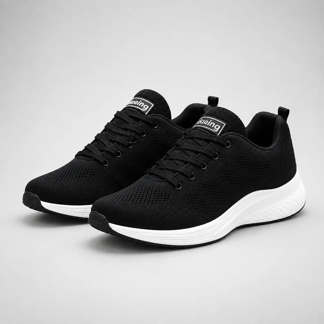 Rear view of women's cushioned trainers with pink heel tab and textured outsole