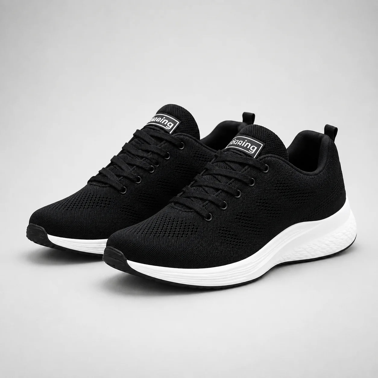 Rear view of women's cushioned trainers with pink heel tab and textured outsole