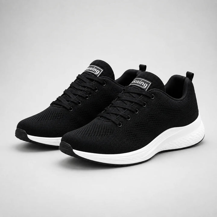 Rear view of women's cushioned trainers with pink heel tab and textured outsole