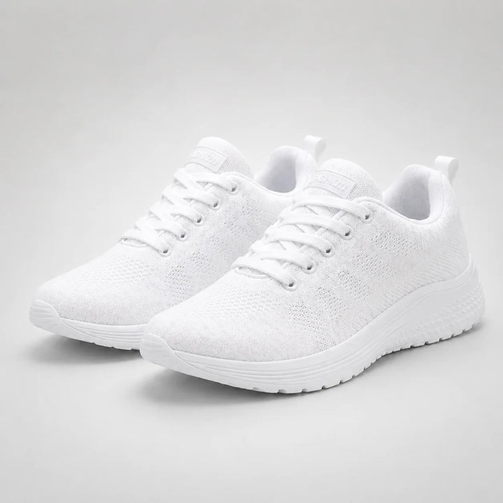 Top view of women's knit trainers showing breathable mesh upper and padded tongue
