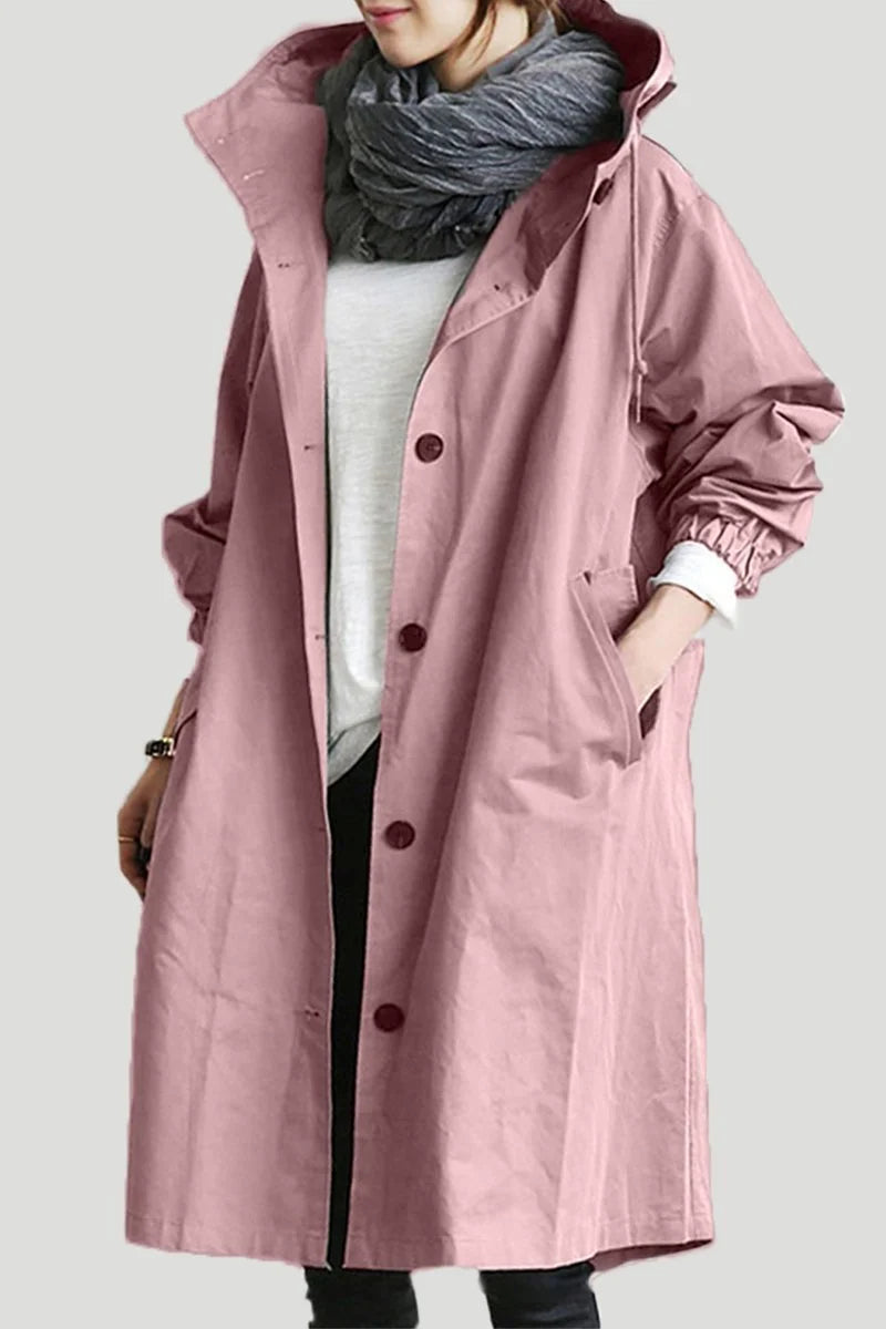 Close-up of structured hood with adjustable drawstring collar on women's oversized trench coat