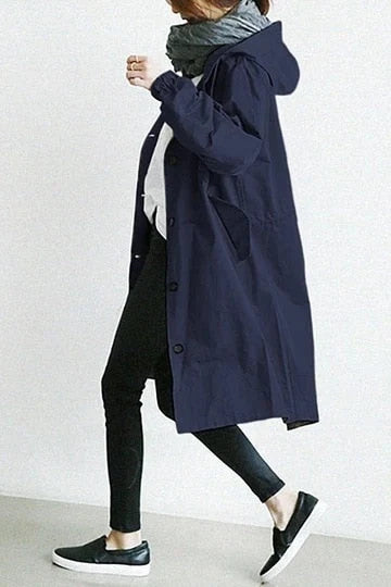 Full-length view of hooded trench coat falling below the knee with side pockets