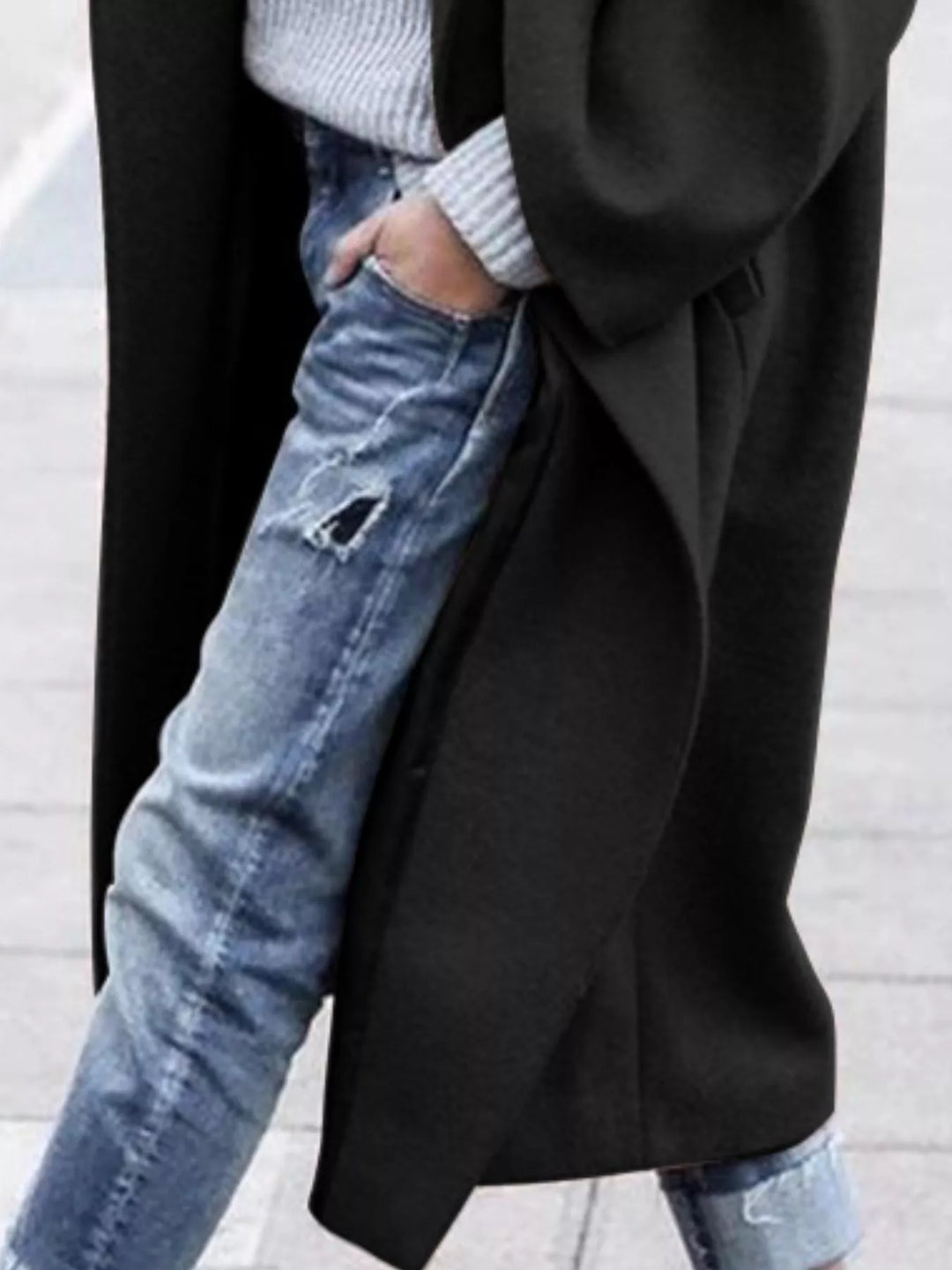 Women's oversized long coat styled with ribbed knitwear demonstrating versatile layering options for autumn winter