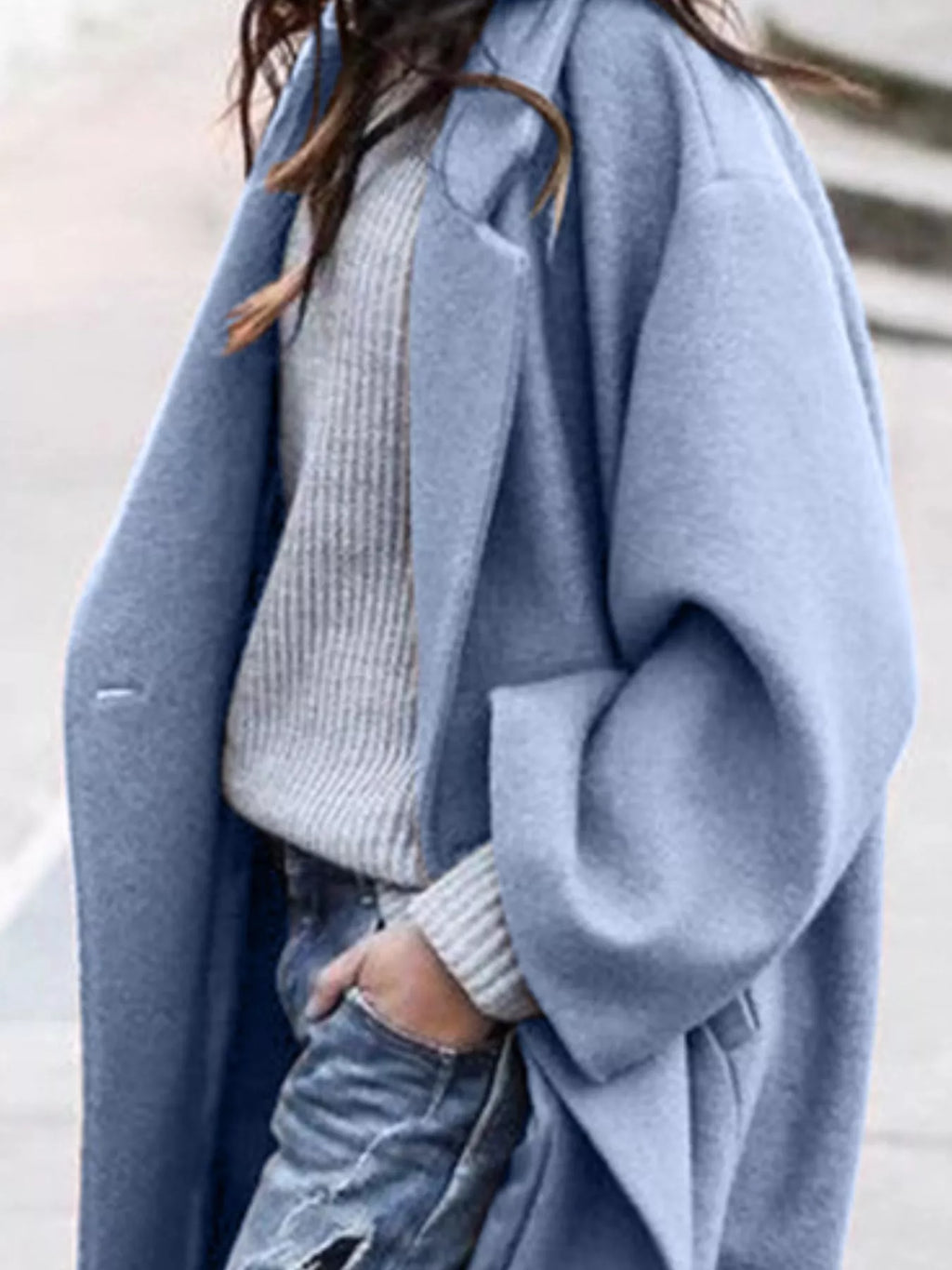 Women's oversized long coat with wide sleeves and open-front design perfect for layering over knitwear