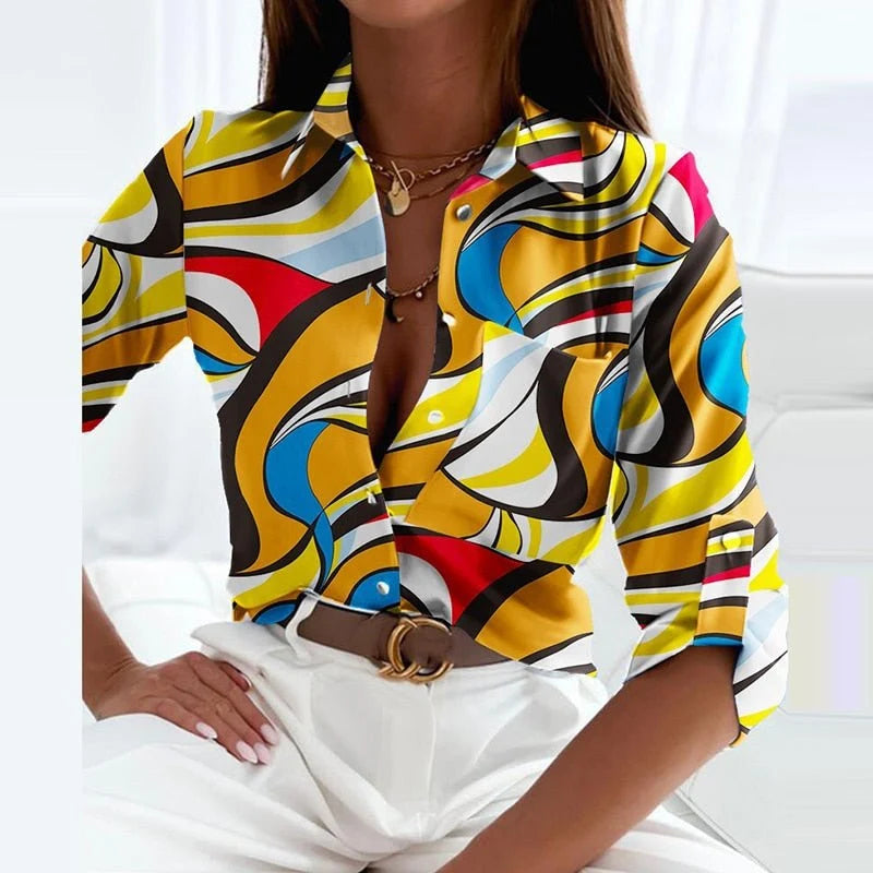Side view of women's printed blouse featuring chest pocket and relaxed fit