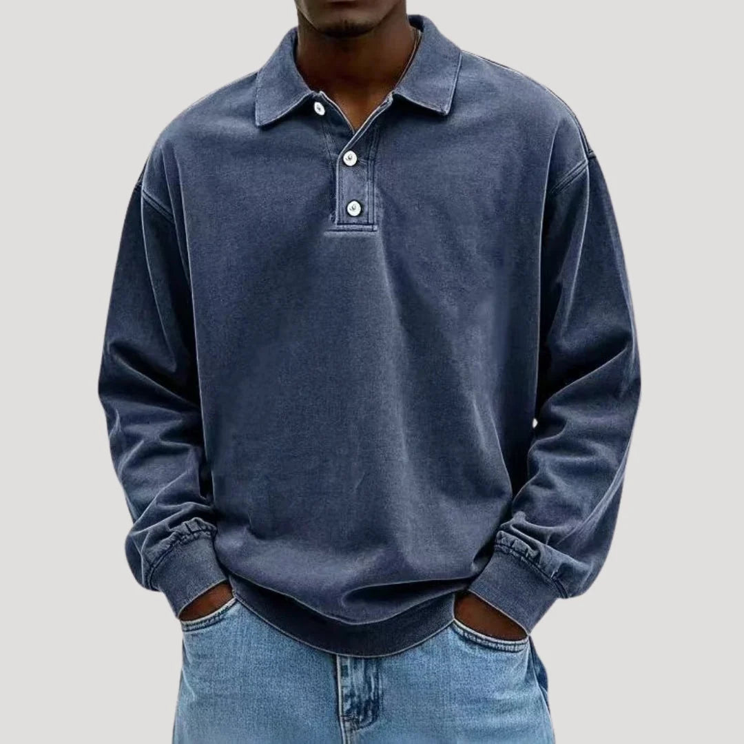 Close-up of button placket detail on men's long sleeve polo with brushed fabric finish