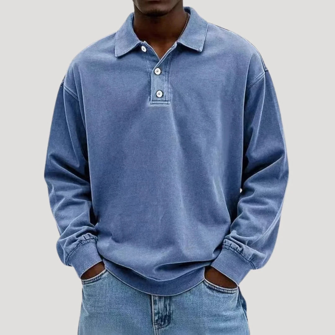 Close-up view of men's polo shirt showing button placket and soft brushed fabric texture