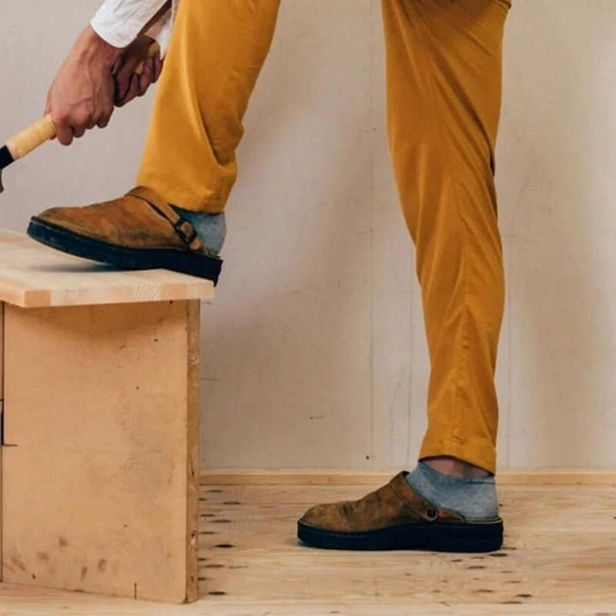 Detail shot of textured rubber sole on men's arch support mules for reliable traction