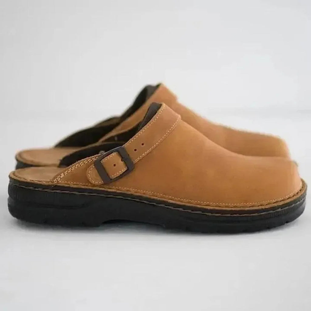 Men's slip-on mules with closed-toe silhouette and cushioned orthopedic footbed for all-day wear