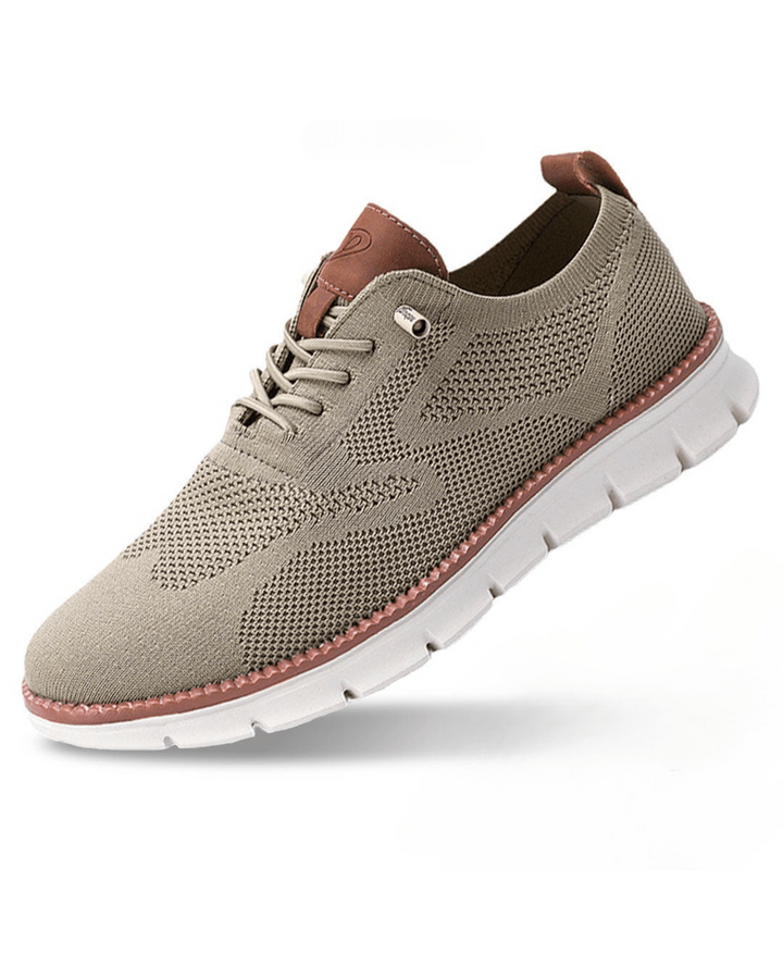 Men's knit trainers in beige with textured mesh upper, lace-up front, contrast heel tab, and cushioned sole.