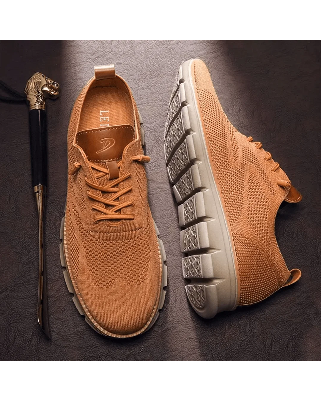 Men's knit trainers in olive displayed from front angle with lace-up detail visible.