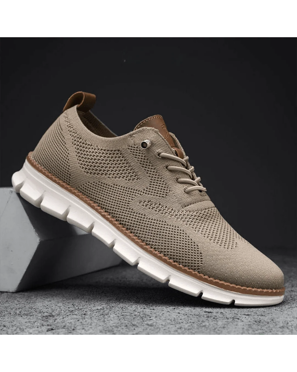 Men's knit trainers in caramel tone showing contrast trim and textured mesh upper.