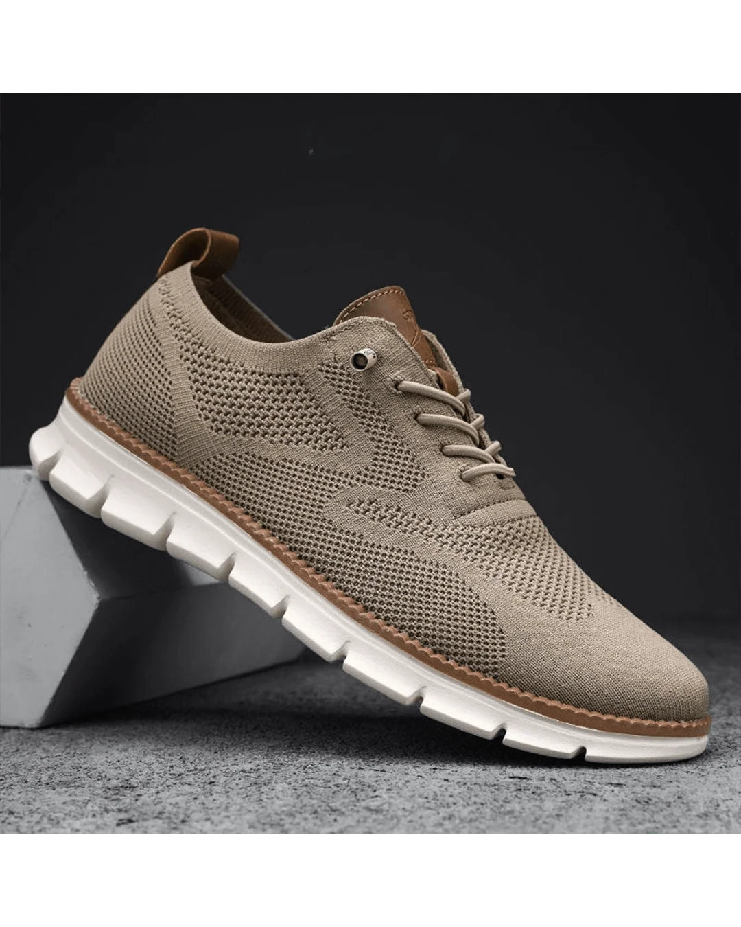 Men's knit trainers in caramel tone showing contrast trim and textured mesh upper.