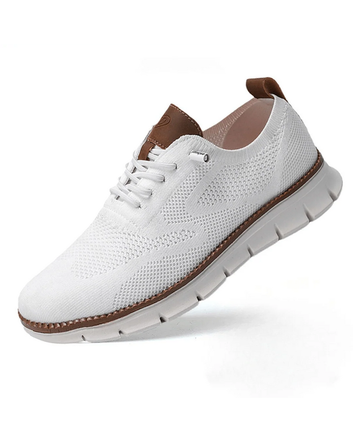 Close-up of men's knit trainers highlighting lace-up detail and contrast stitching on heel tab.