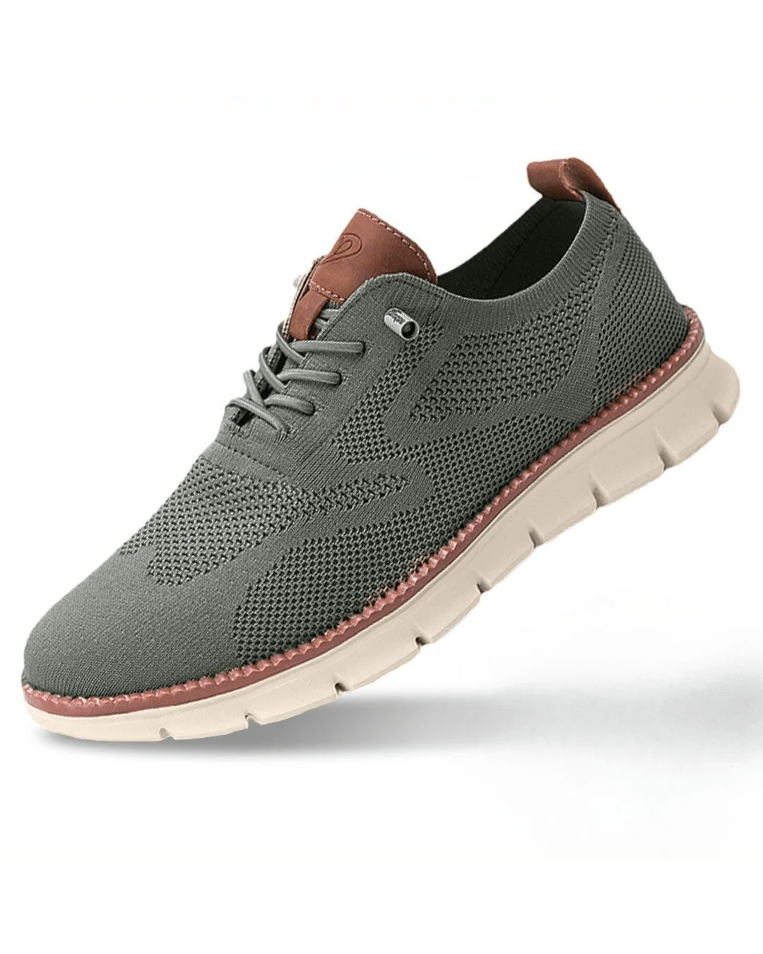 Front angle of men's knit trainers displaying rounded toe and breathable mesh upper.