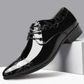Men's patent embossed Derby shoes with tonal swirl detailing and pointed toe on display