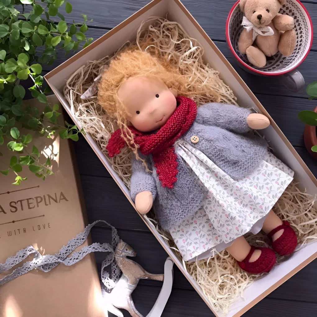 Close view of handmade Waldorf cuddly doll with soft wool stuffing