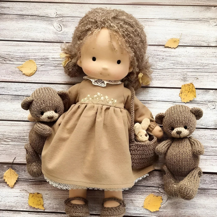 Handmade Waldorf doll with ribbed knit sleeves and gentle design for toddlers