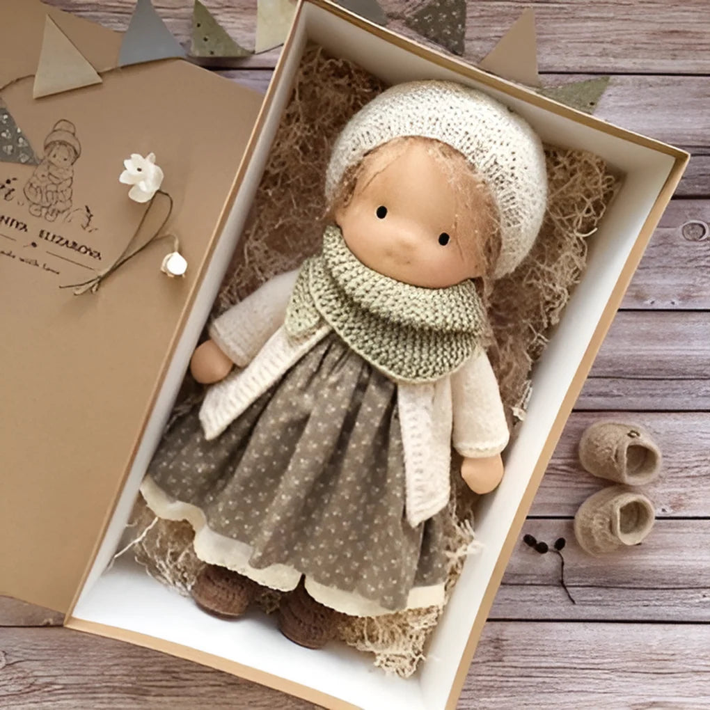 Close-up of handmade Waldorf cuddly doll with natural cotton and wool construction
