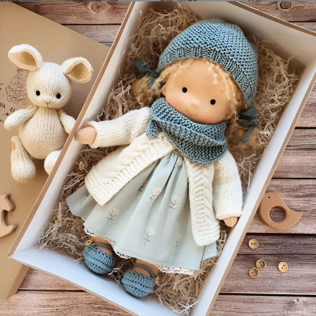 Handmade Waldorf doll with soft facial features and muted tones for children