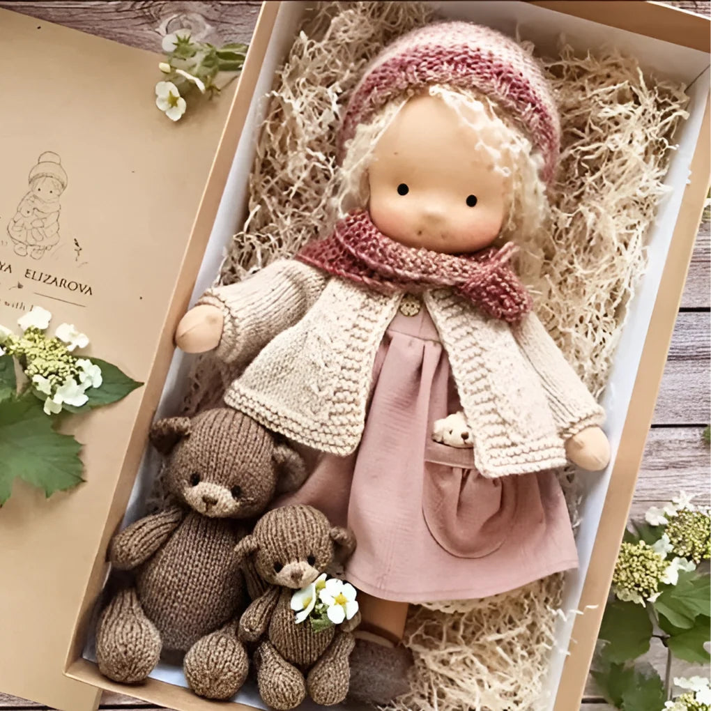 Handcrafted Waldorf cuddly doll with pastel dress and ribbed knit trousers