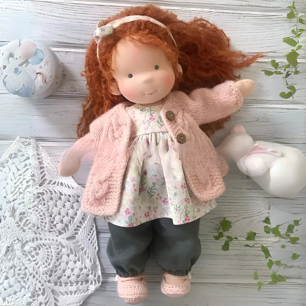 Close view of handmade Waldorf cuddly doll with wool stuffing and cotton outer