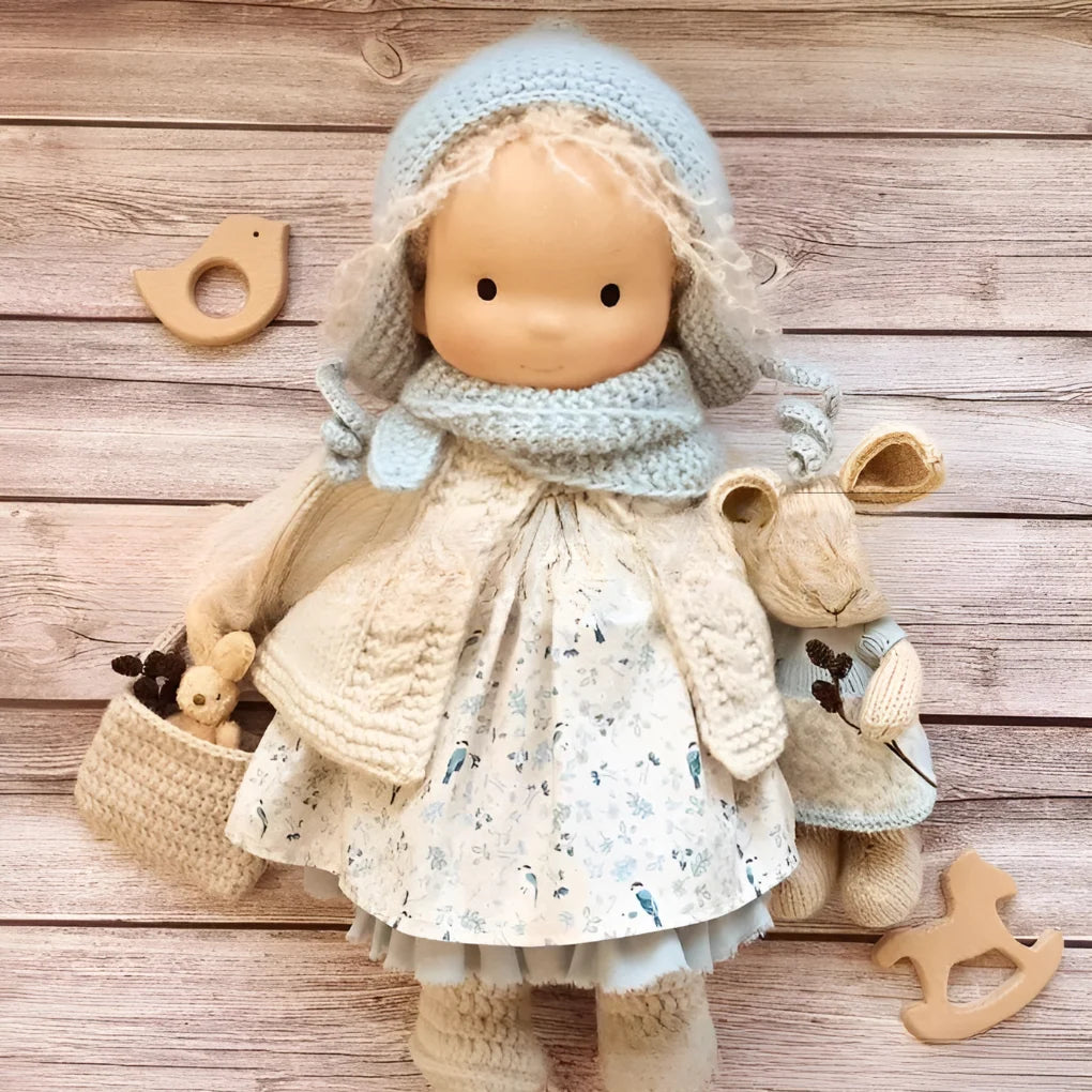 Natural cotton Waldorf cuddly doll with simple features and soft construction