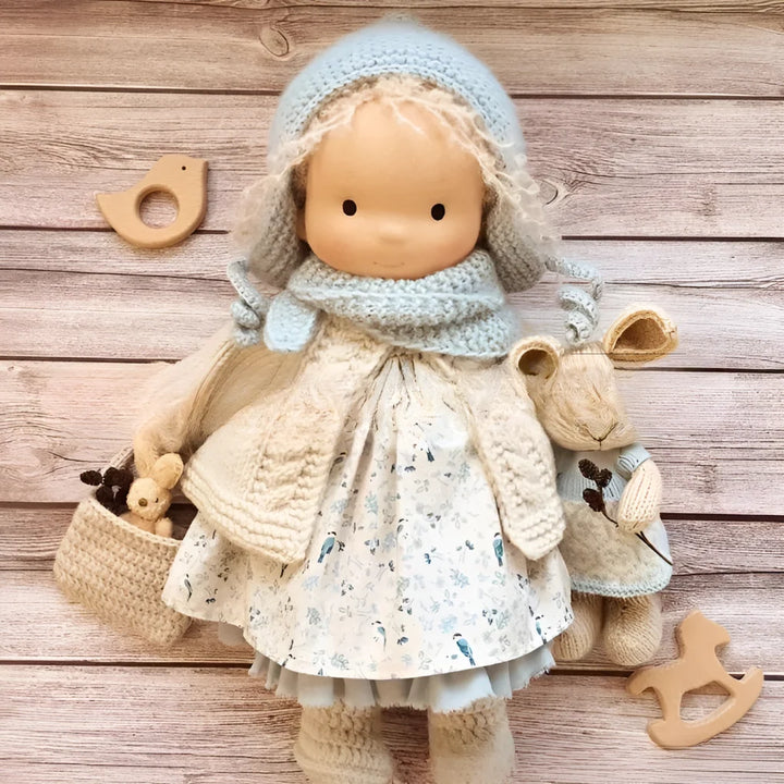 Natural cotton Waldorf cuddly doll with simple features and soft construction
