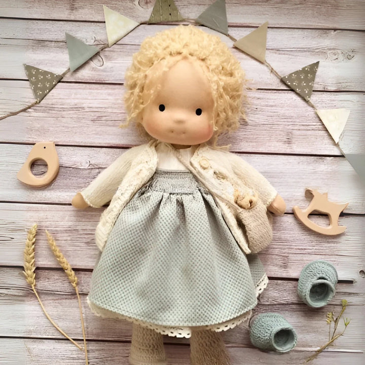 Close-up of handcrafted Waldorf doll with gentle facial expression and natural materials