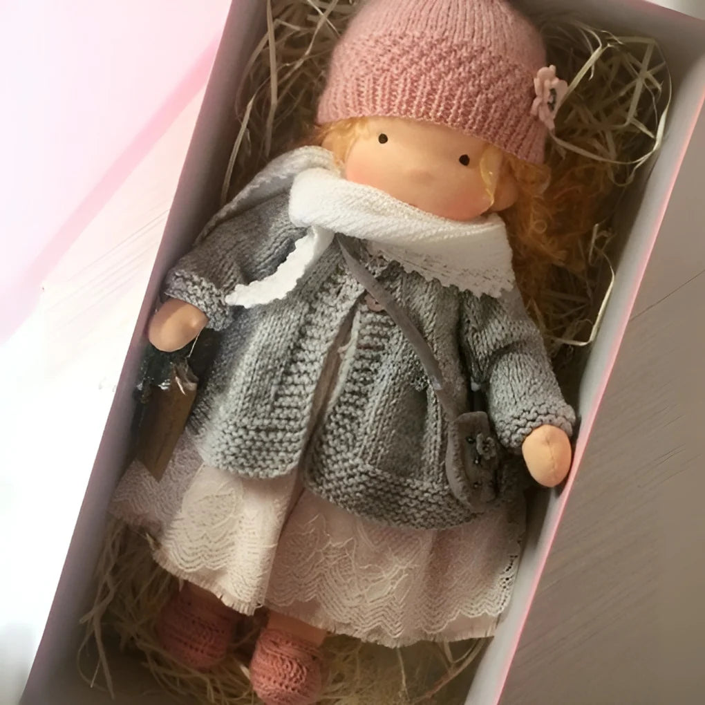 Natural cotton Waldorf doll with simple features to inspire imaginative play