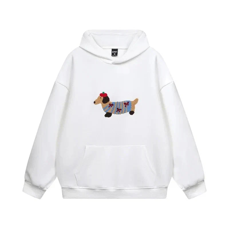 Side view of women's oversized pullover hoodie showing relaxed silhouette and ribbed cuffs