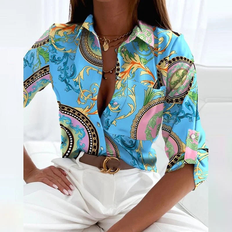 Women's blouse in blue geometric print styled with statement belt for work-appropriate outfit