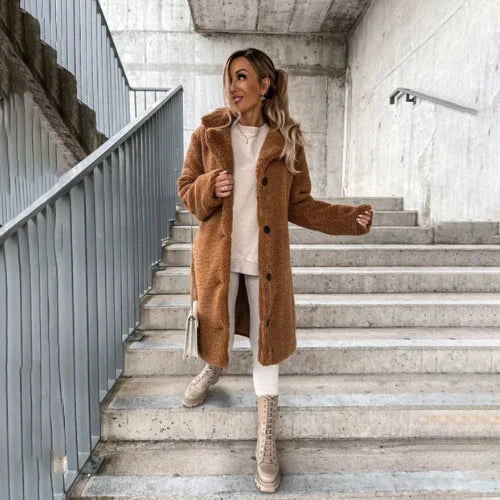 Women's teddy coat in neutral tone perfect for layering over winter knitwear