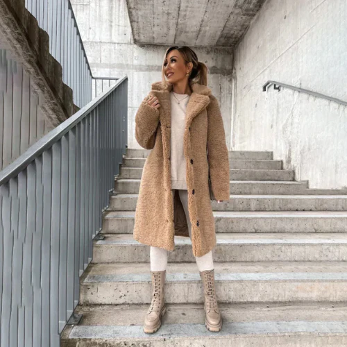 Back view of women's teddy coat showing relaxed fit and mid-thigh length