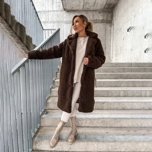 Women's teddy coat styled with matching trousers and crossbody bag for casual outings