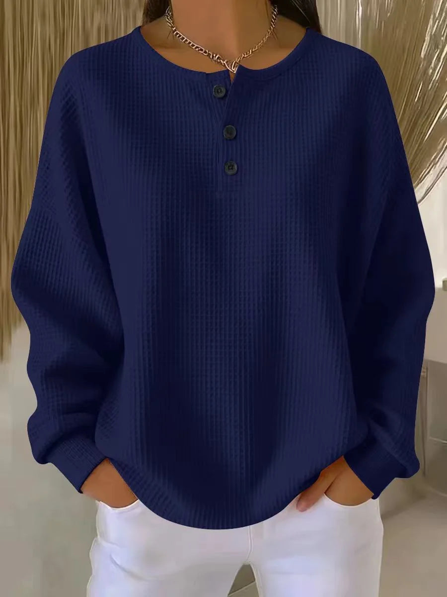 Back view of drop shoulder waffle knit henley jumper in relaxed silhouette