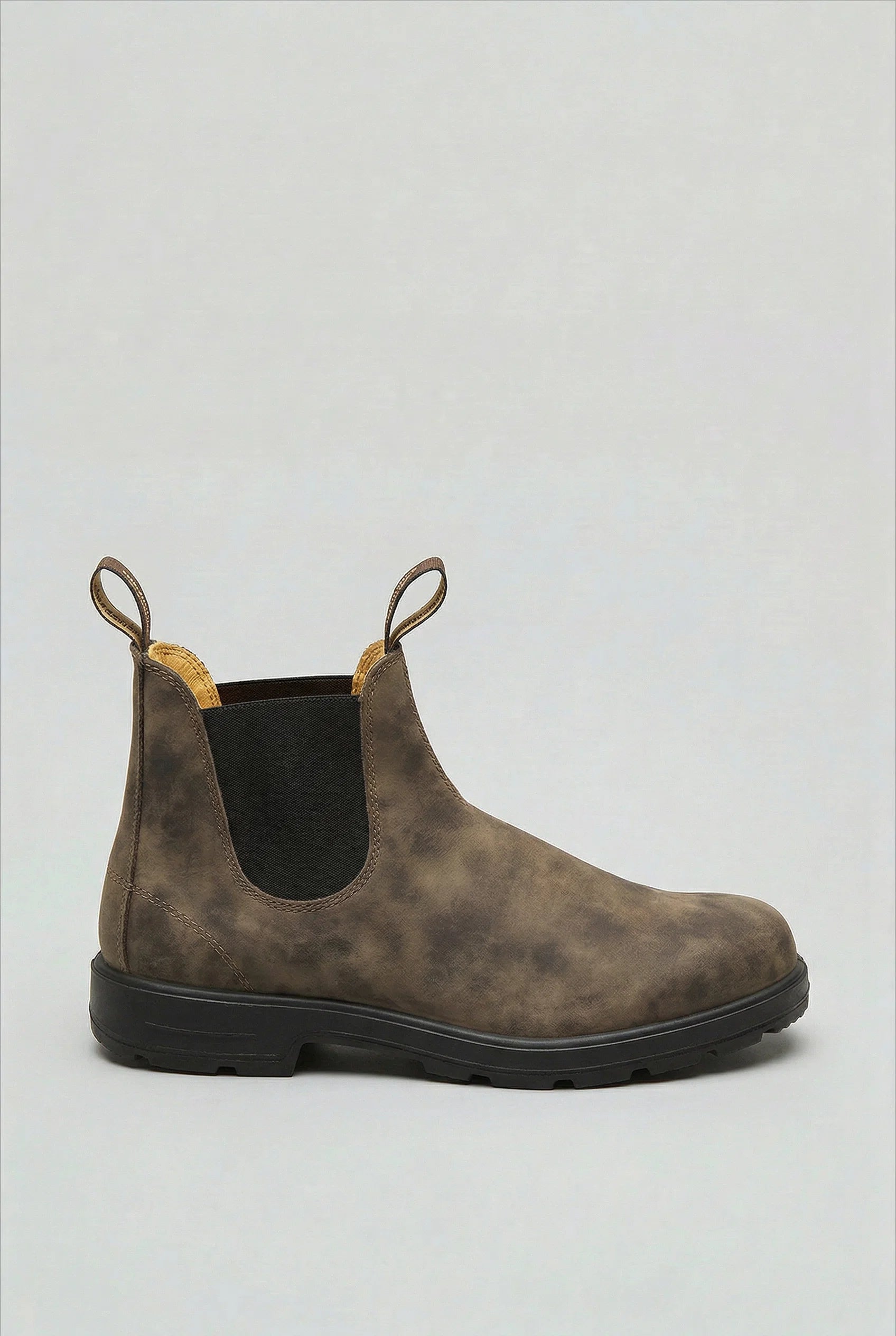 Close-up of men's Chelsea boot elastic side panel and smooth upper construction