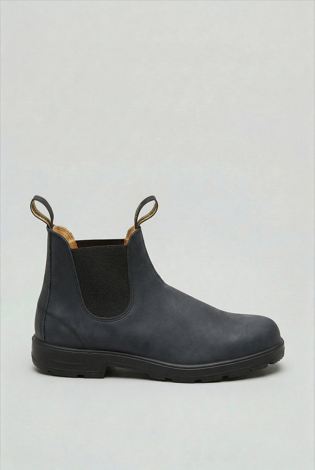 Men's Chelsea boots sole view showing grippy tread pattern for stability