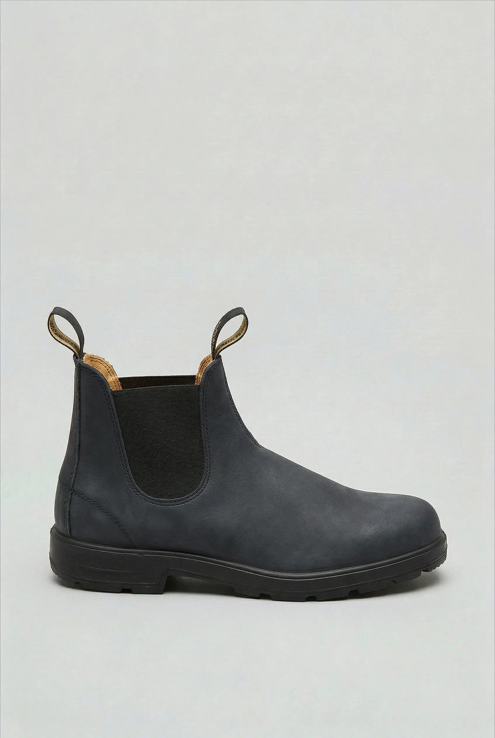 Men's Chelsea boots sole view showing grippy tread pattern for stability