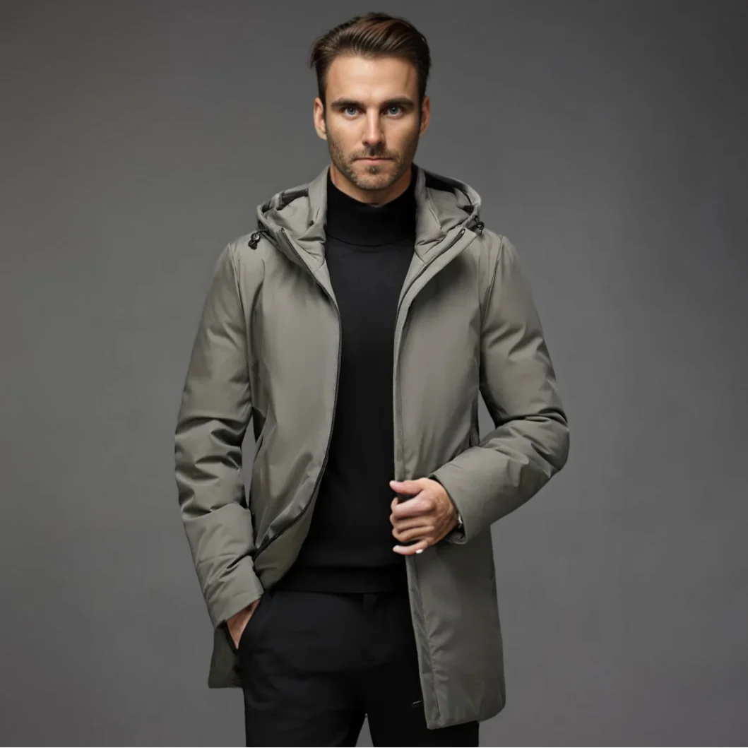 Men's black parka jacket styled with black trousers for casual winter wear