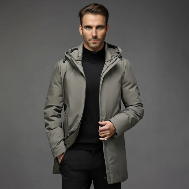 Men's black parka jacket styled with black trousers for casual winter wear