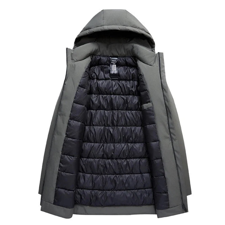 Detail of zip fastening and front pockets on men's hooded parka jacket