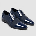 Men's patent leather Oxford shoes with cap toe design and textured mesh detailing in navy blue