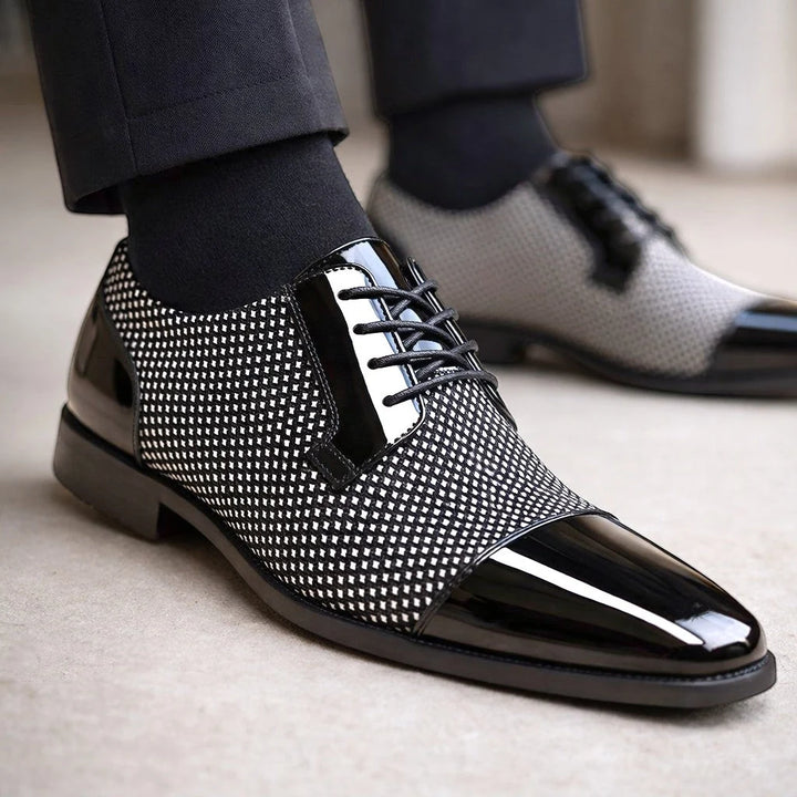 Structured men's formal shoes with cap toe detailing and glossy navy finish