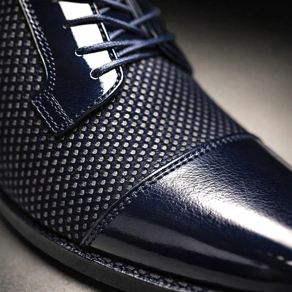 Men's navy patent leather dress shoes with textured detailing for formal occasions